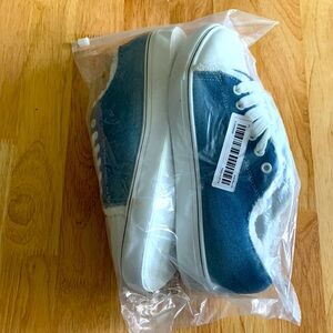 Distressed denim sneakers